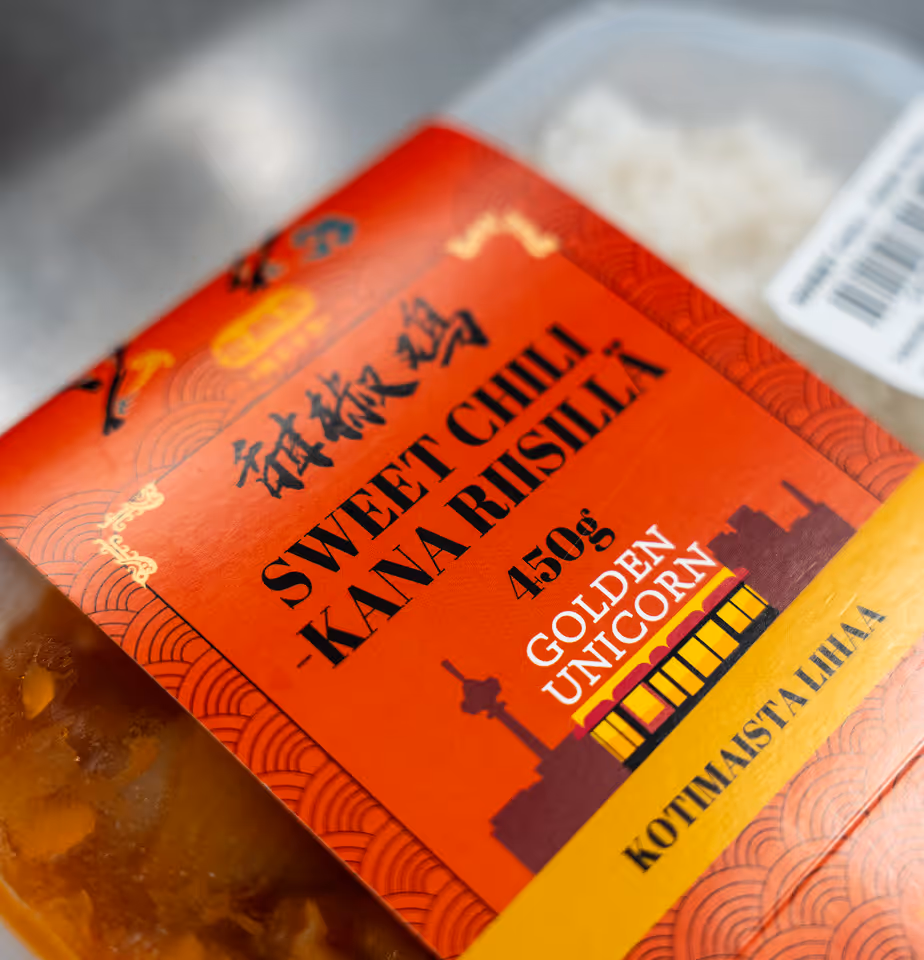 Golden Unicorn Sweet Chili Chicken meal in red packaging.